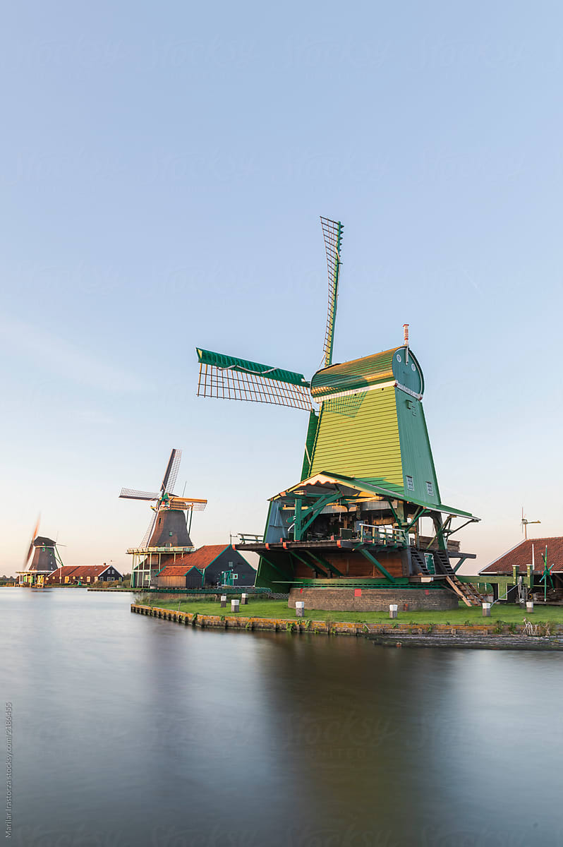 Traditional dutch windmill near a canal