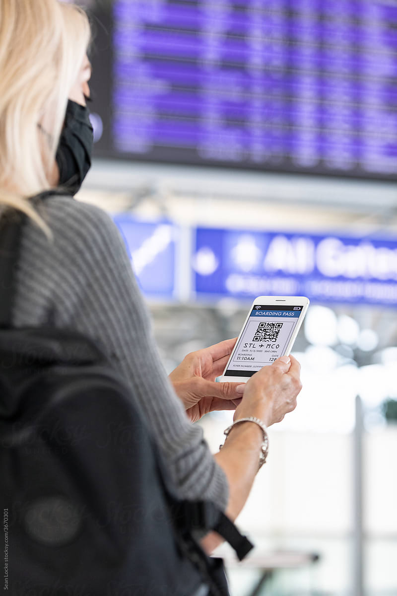 Travel: Woman Checks E-Ticket On Cell Phone