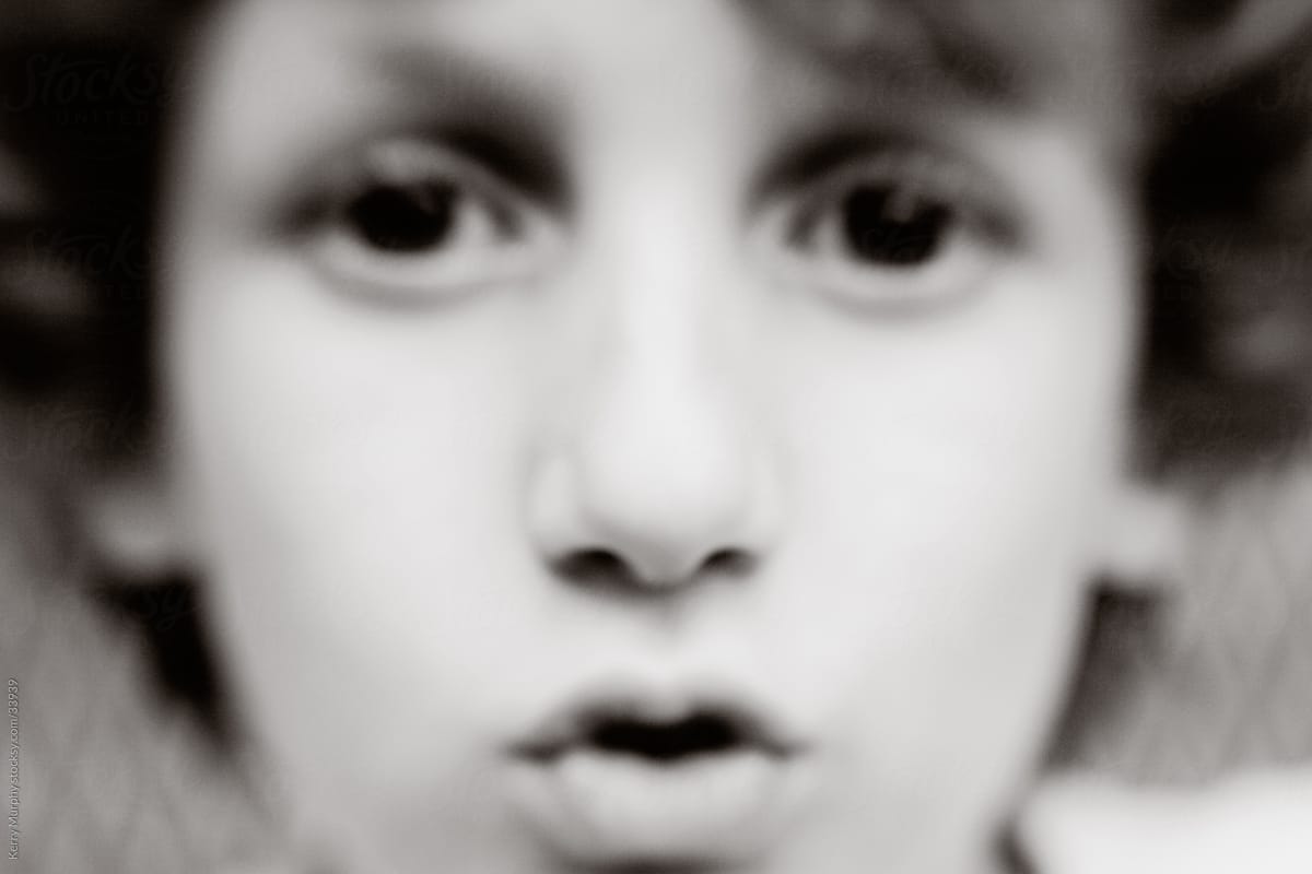 Black and white closeup of young boy\'s face