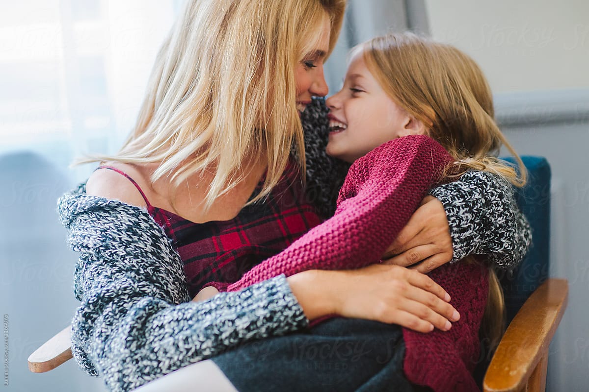 Mother Holding Her Daughter In Her Lap By Stocksy Contributor Lumina Stocksy 