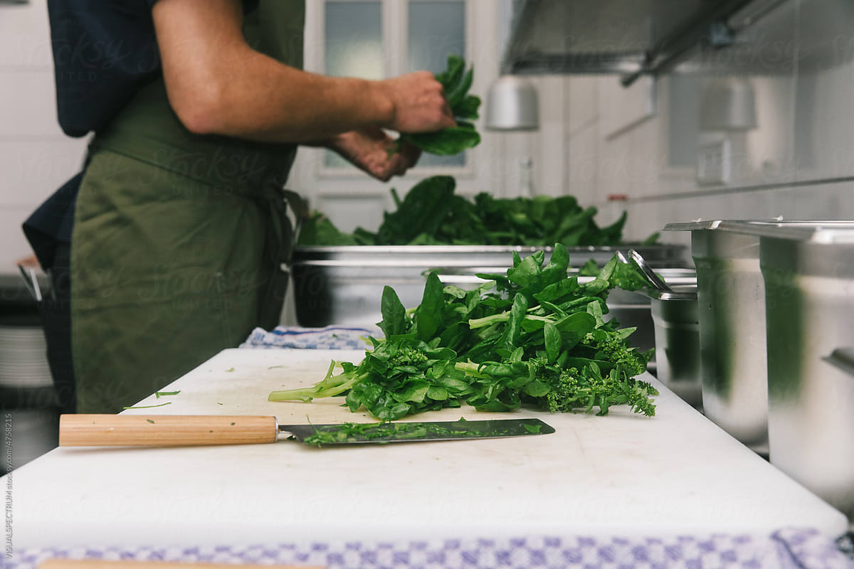 Anonymous Chef Preparing Fresh Spinach
