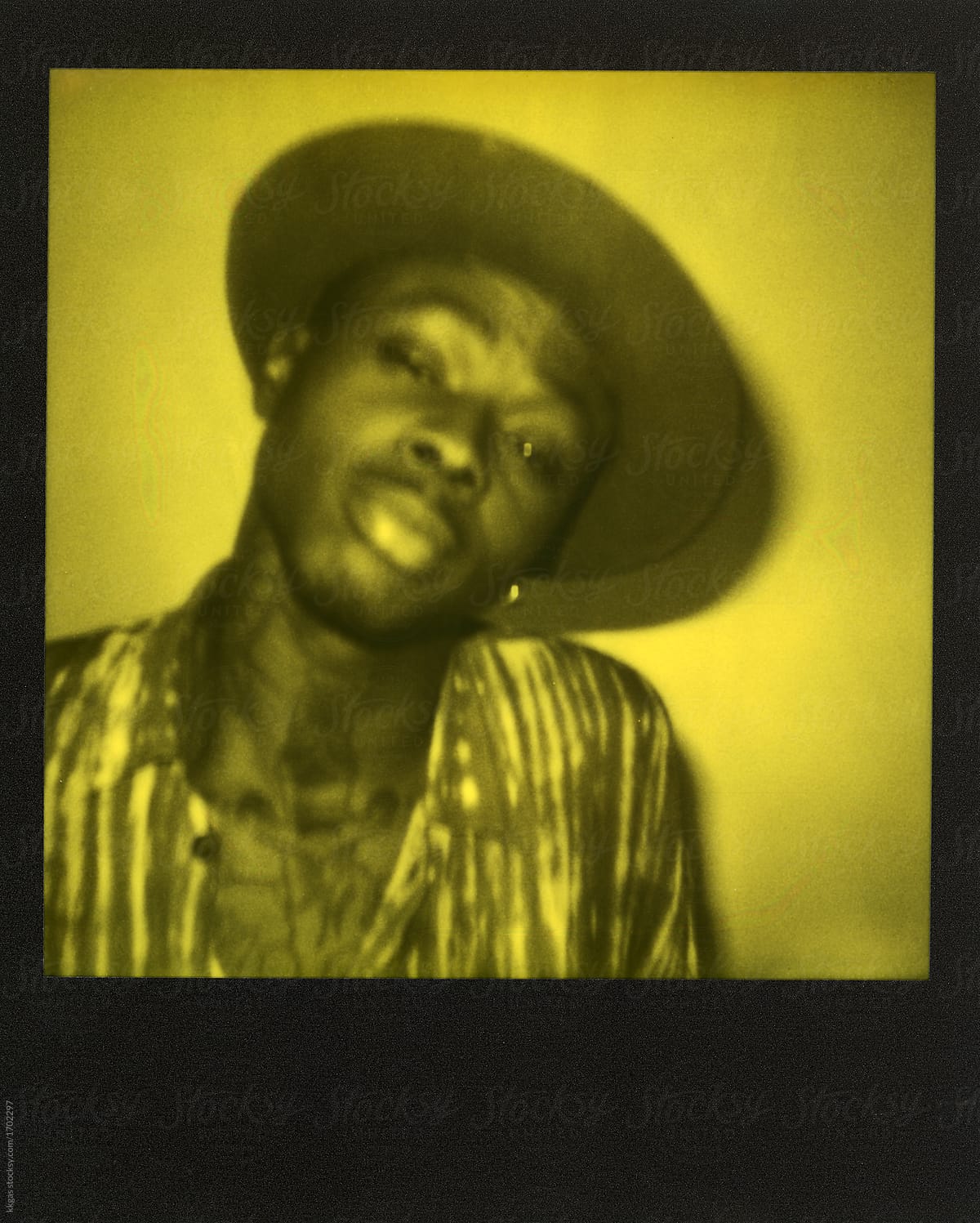 Yellow duochrome polaroid scan of a cool tattooed black man