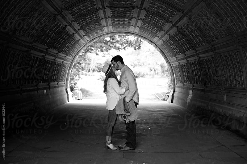 couple kissing in tunnel