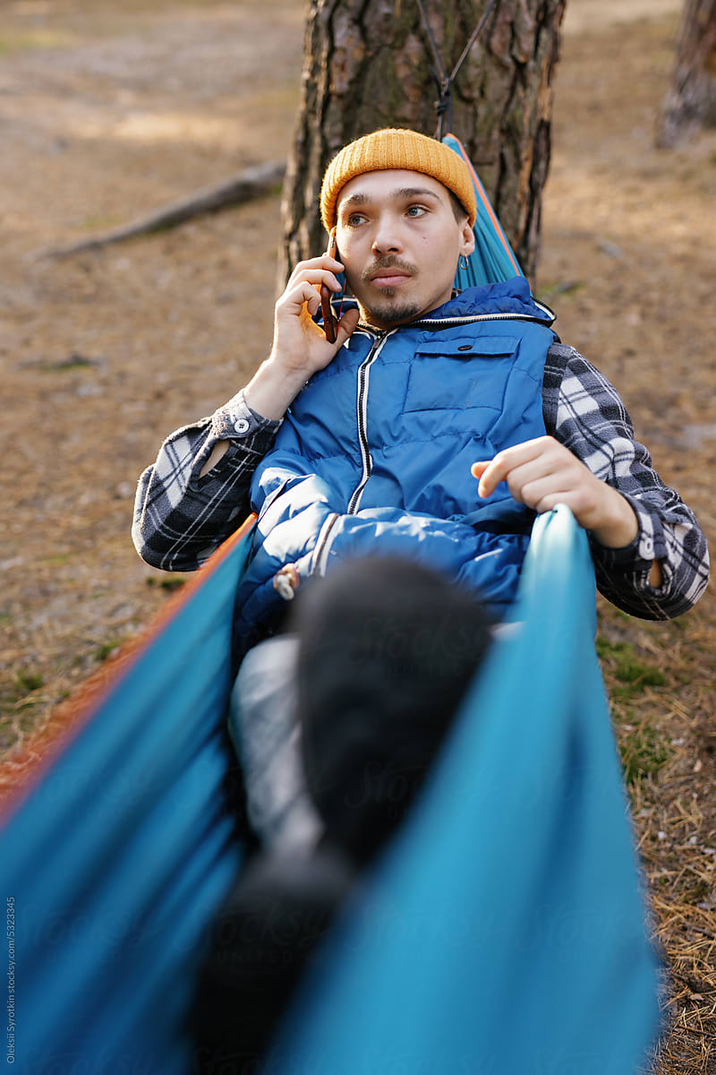 Phone conversation sad outdoor rest call