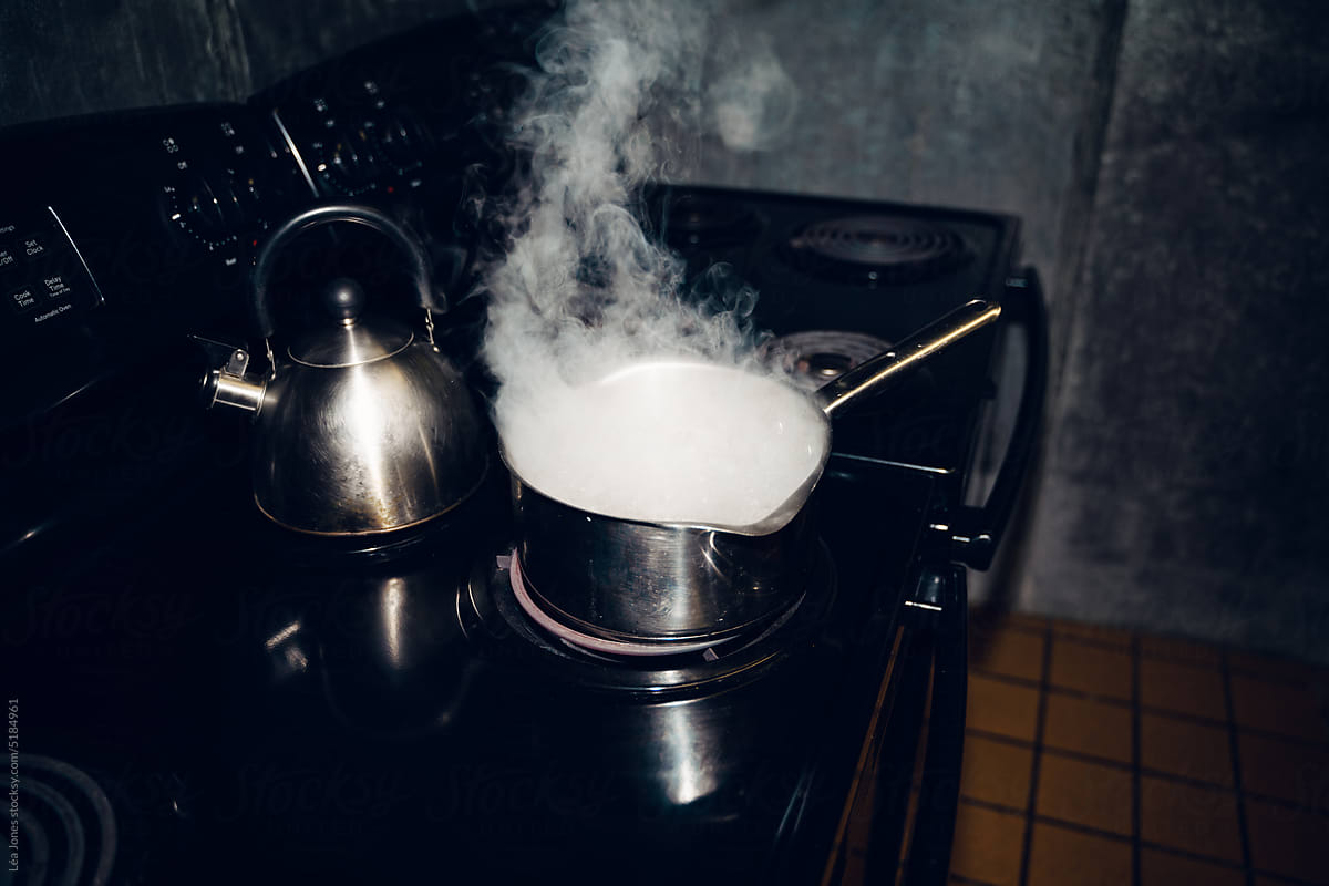 UGC pan with water on stove