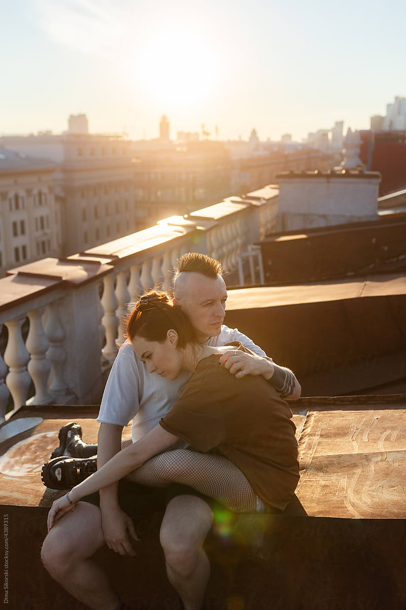 pre-wedding photo shoot on the roof at sunset
