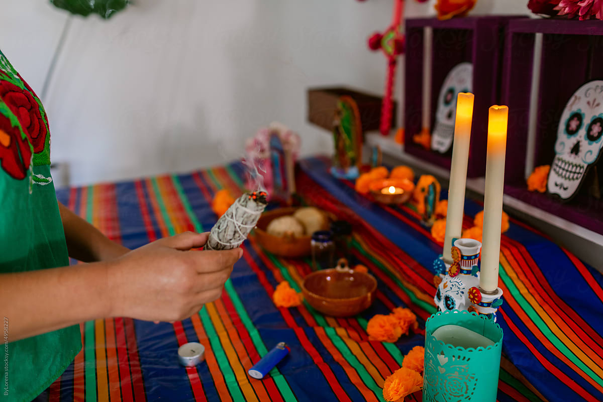Woman preparing Day of the Dead altar