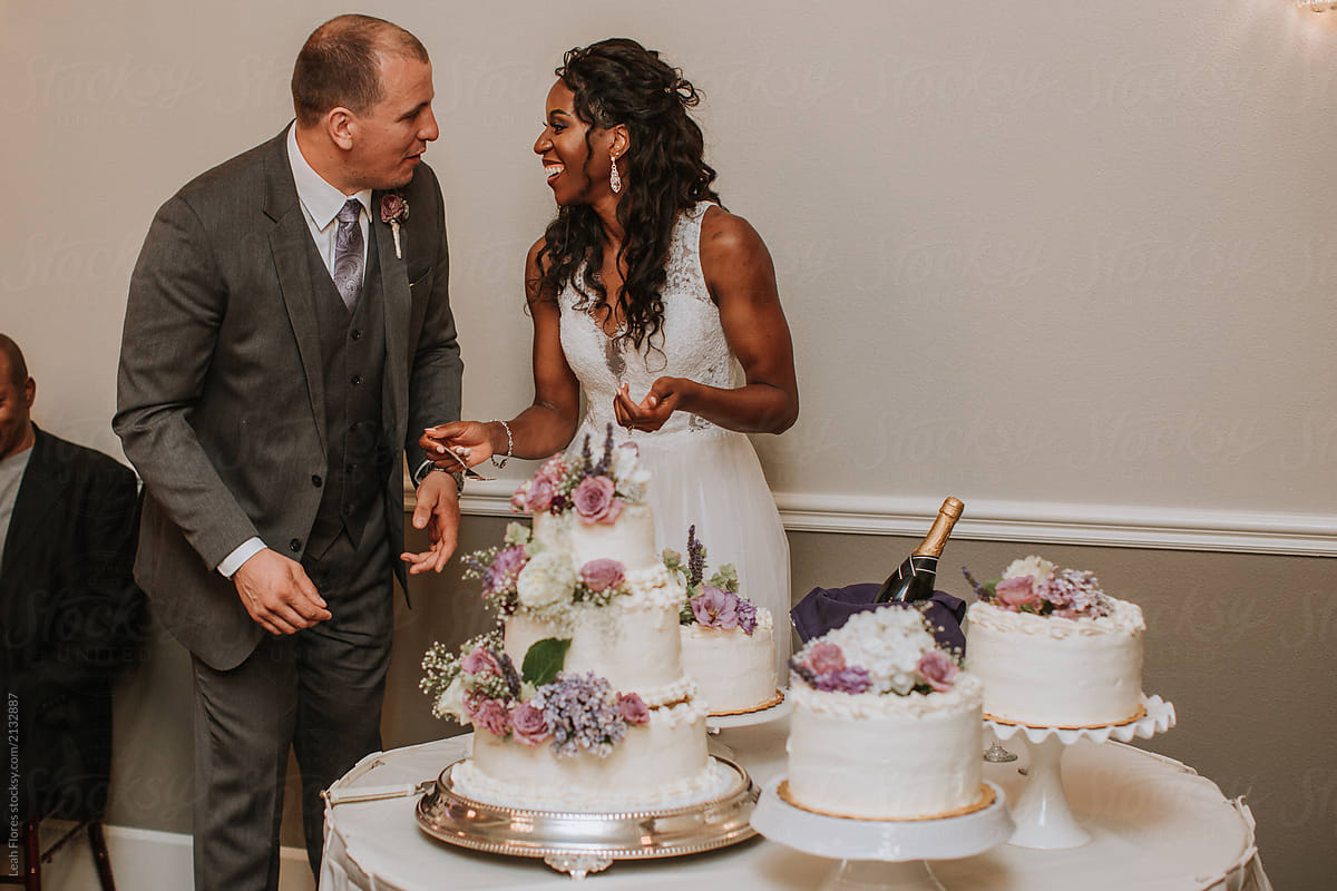 Bride and Groom Cutting Wedding Cake