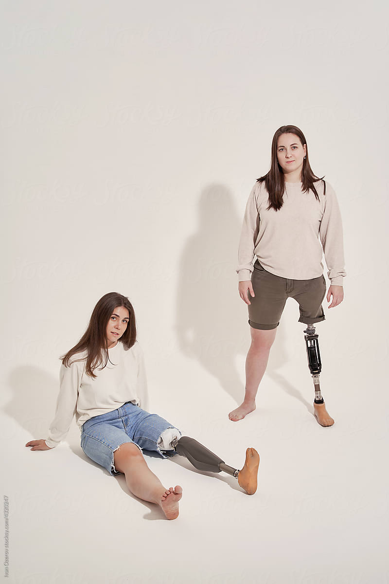 Positive Handicapped Woman Bending To Prosthetic Leg by Stocksy