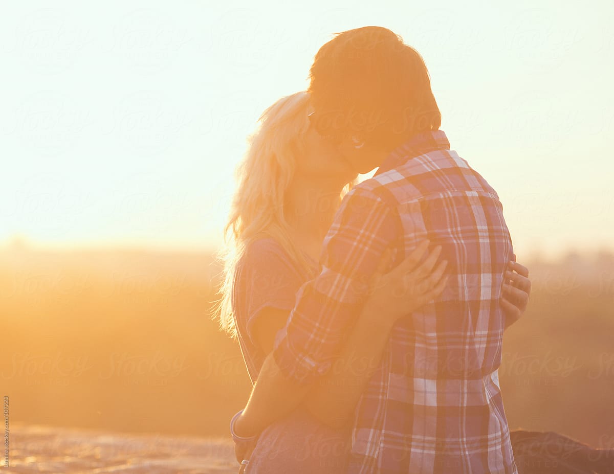 Teenage Couple Kissing In The Sunset By Stocksy Contributor Lumina