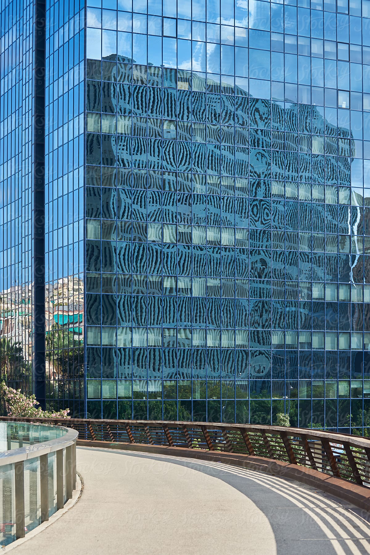 Reflection of modern building in glass building facade.