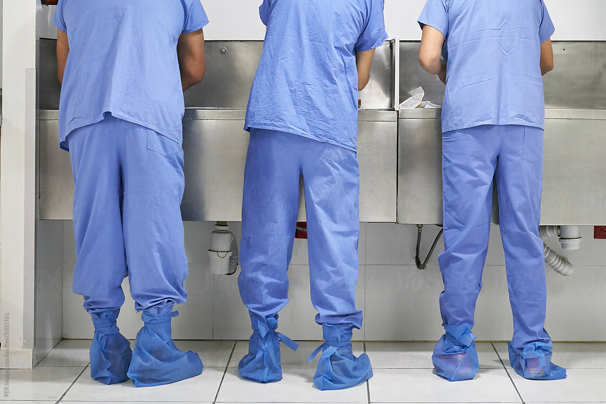 three-doctors-and-nurses-washing-their-hands-in-a-hospital-by-per-images