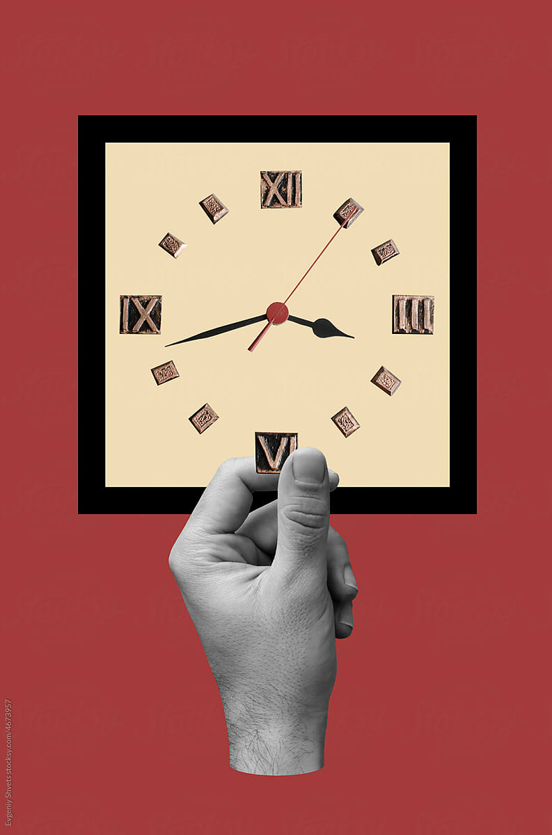 Male hand holding clock face