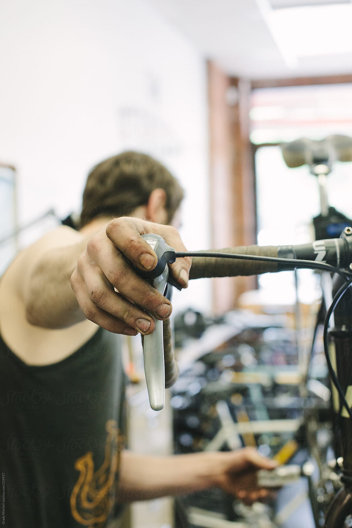 Bike Mechanic Works In A Shop