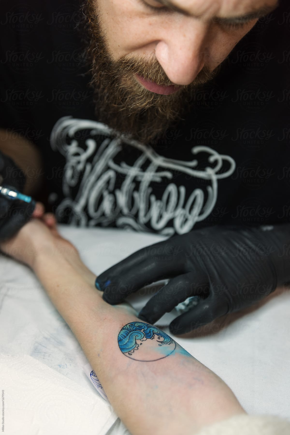 Master watching tattoo on arm