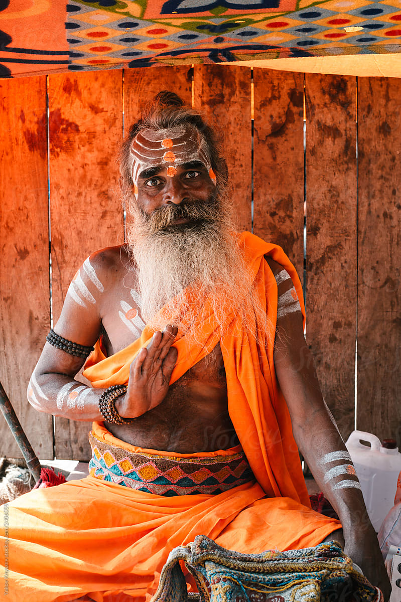 indian yogi with a welcoming gesture