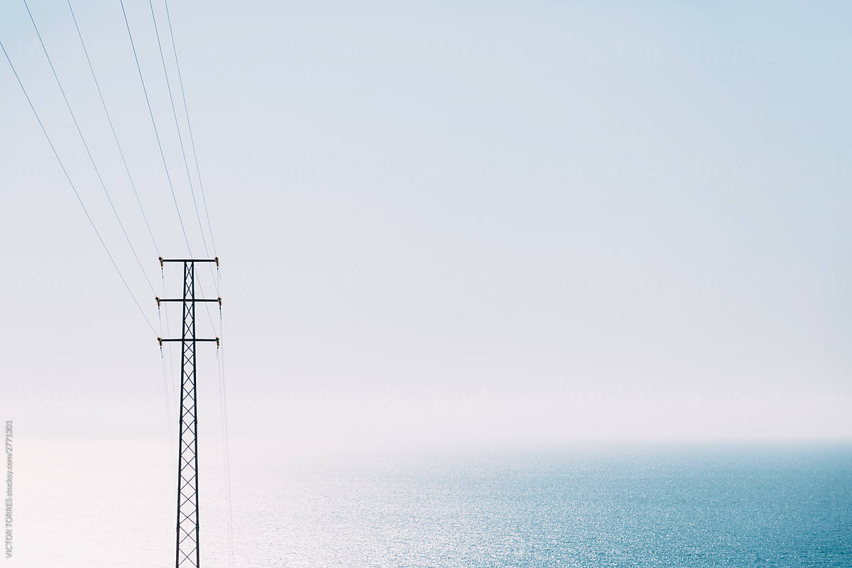 Power line with the ocean at background