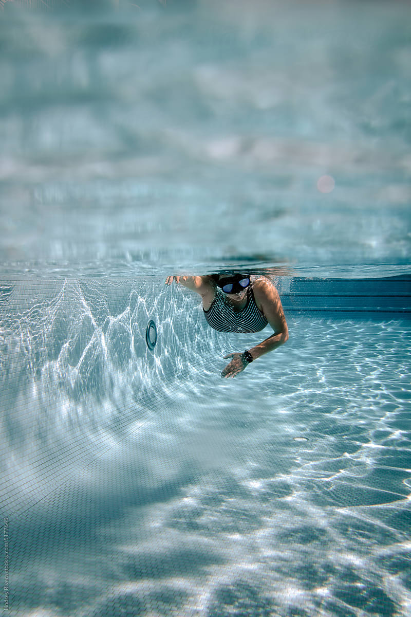 Female Swimming Laps Underwater