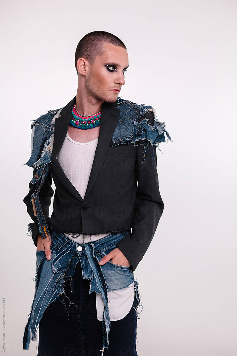 Stylish androgynous man denim handmade upcycle denim outfit in studio