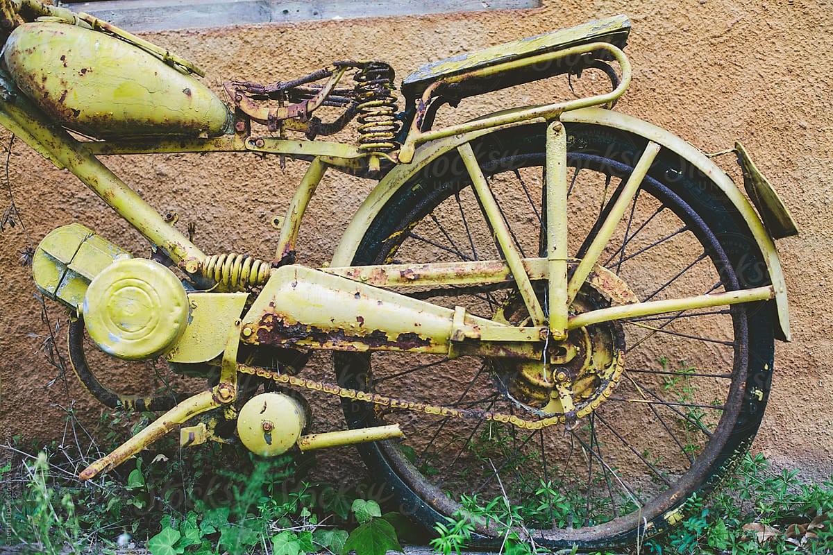 Old yellow motor bike.
