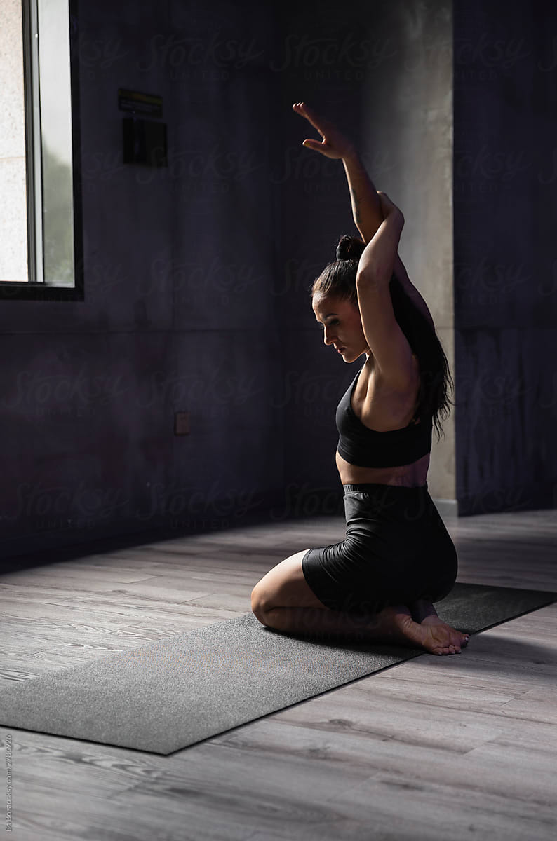 Sexy young woman practice Yoga indoor