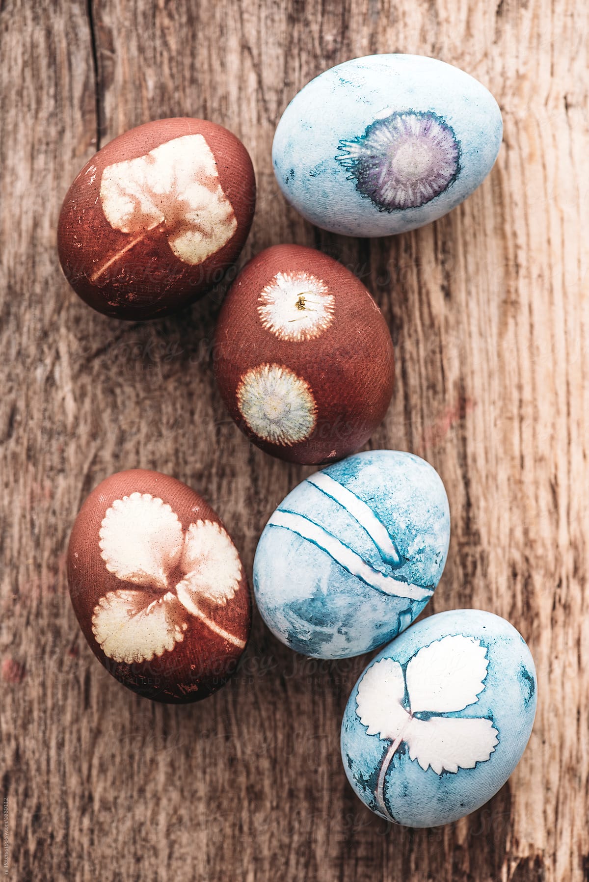 Easter eggs with floral transfers, colored with vegetables, blue
