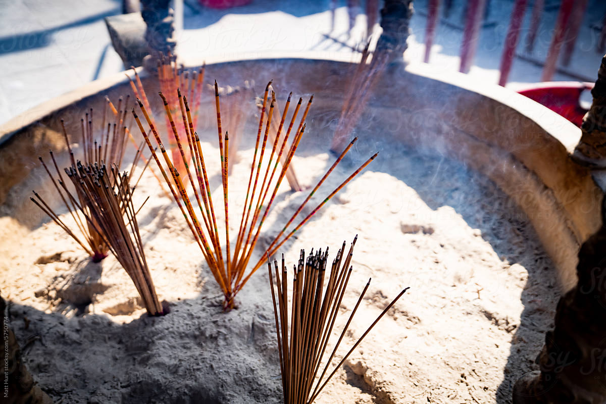 Red sticks of prayer incense burning at a Buddhist temple in Hong Kong