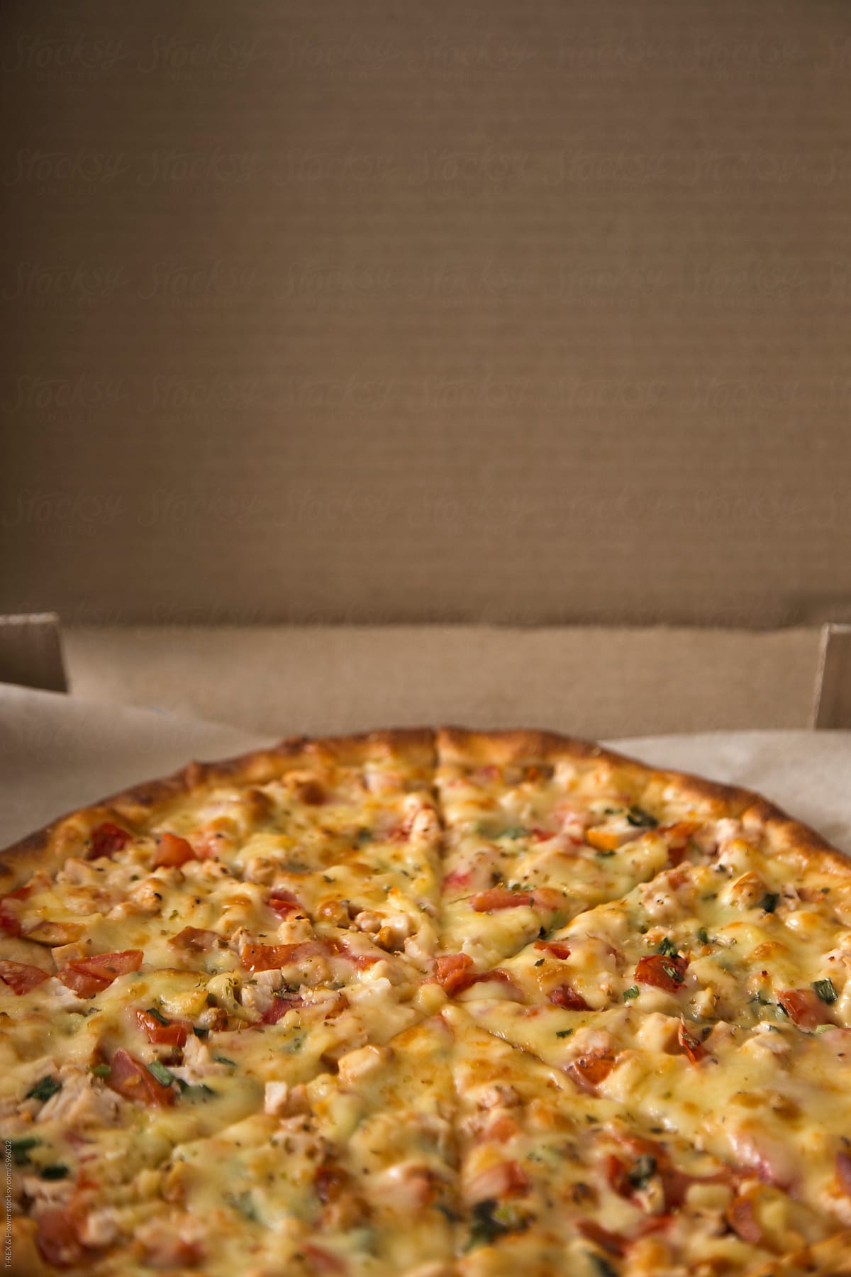Tasty pizza in cardboard box