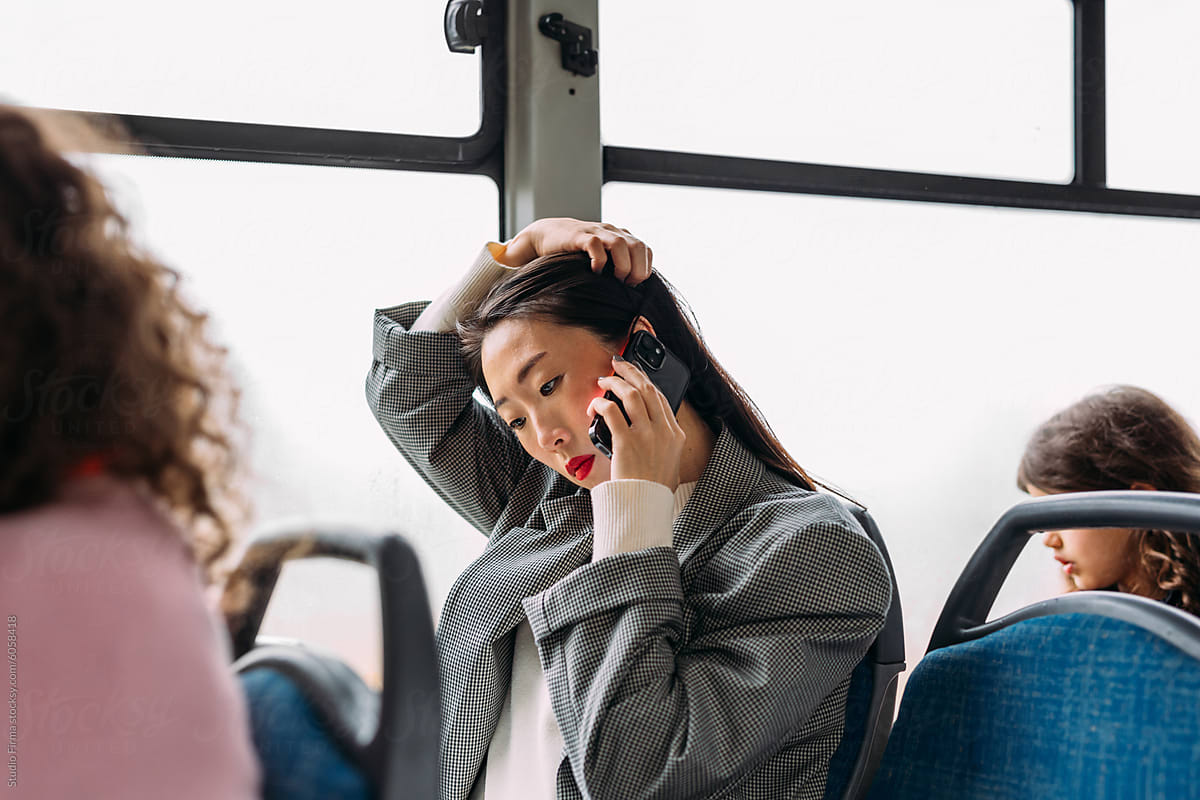 Talking on phone in bus