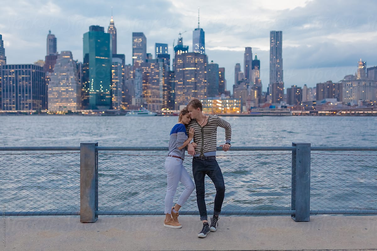 Young Couple in Front Of Manhattan Skyline . New York City US