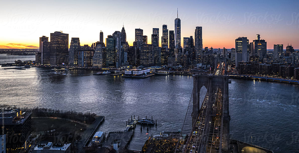 Drone view of Manhattan, New York City and Brooklyn bridge at sunset