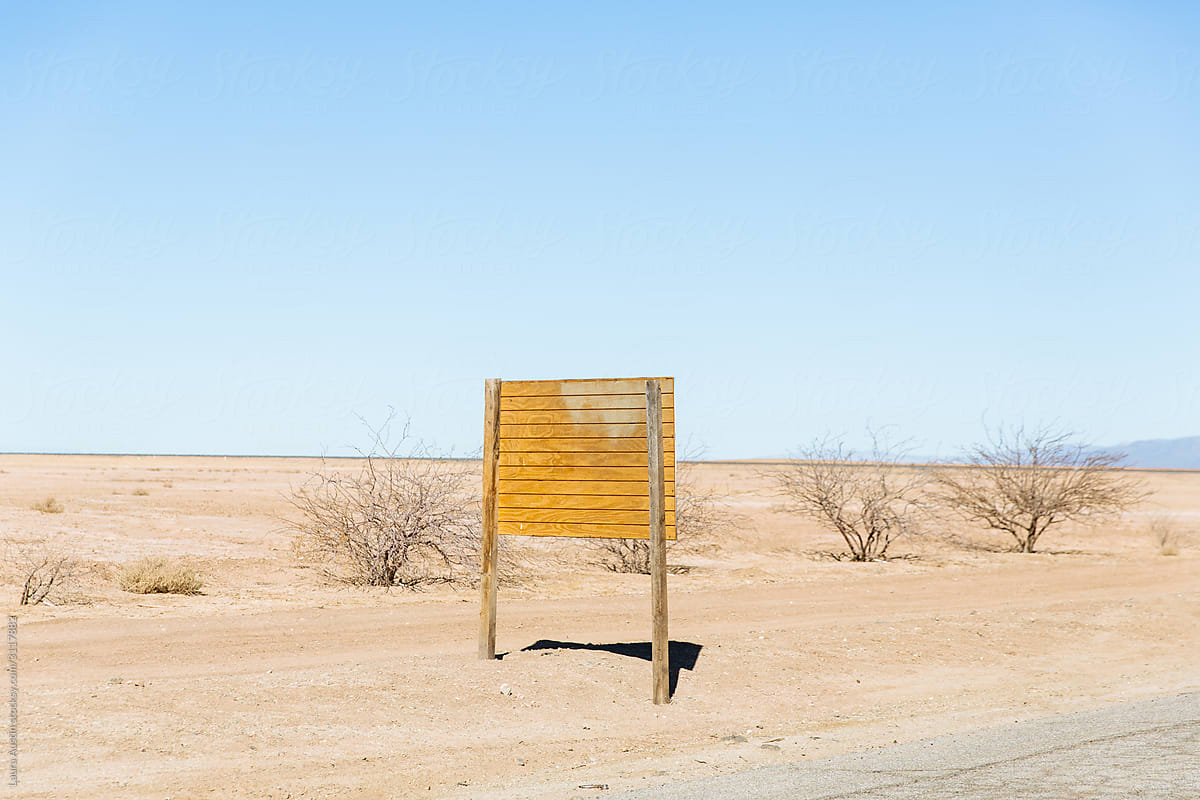 Blank Wooden Sign In The Desert In The Middle Of Nowhere