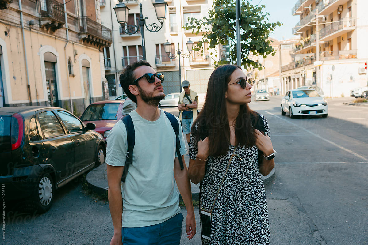 Young tourist couple walking on old Italian city streets