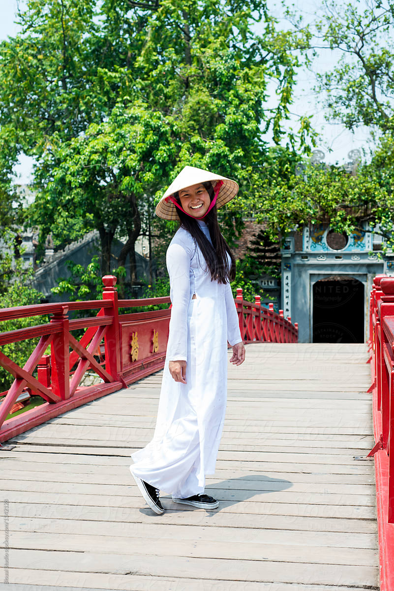 Vietnamese woman on oriental bridge