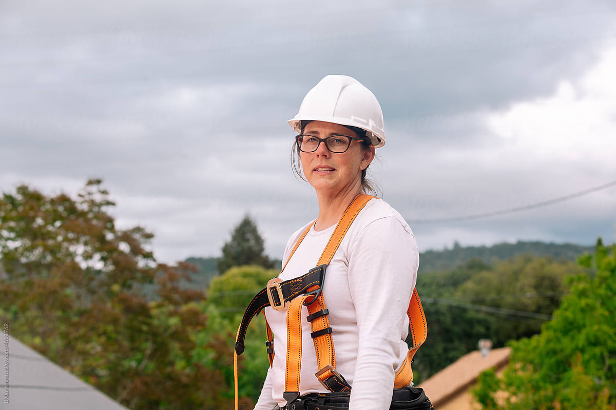 Construction woman solar roof installer