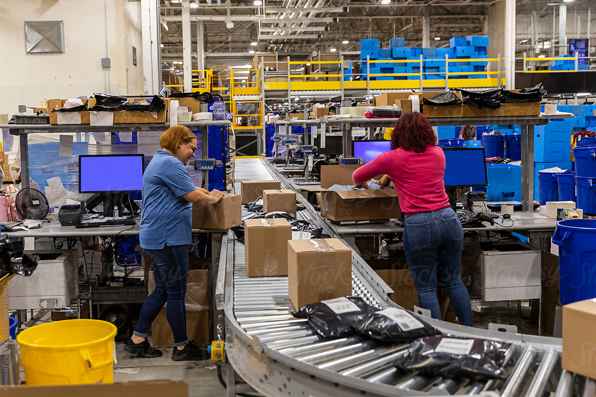 Corporate workers together at warehouse for E-Commerce