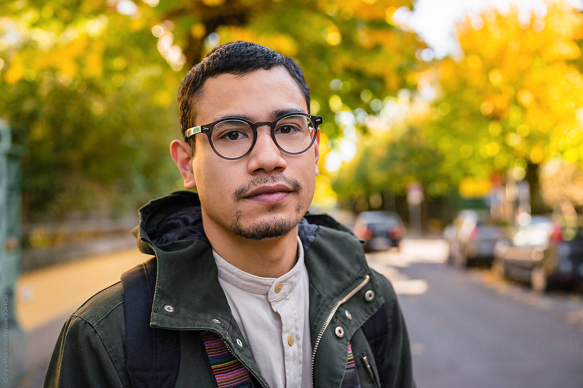 Portrait of a Young Adult Man Outdoors during Autumn