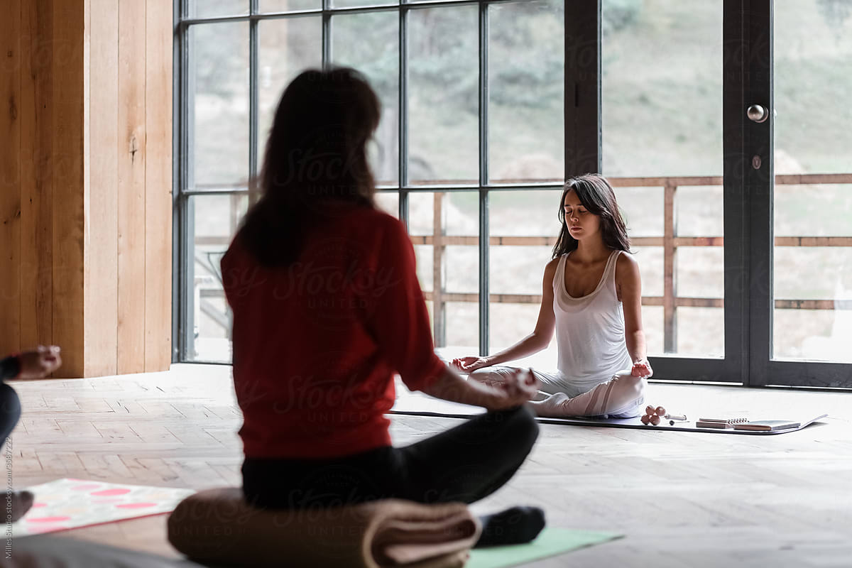 Group Meditating In Yoga Studio by Stocksy Contributor Milles Studio -  Stocksy