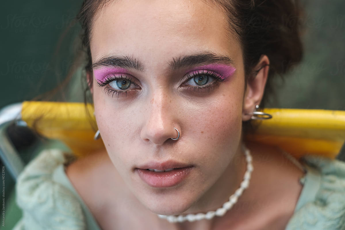 Portrait Of Woman With Green Eyes And Pink Makeup