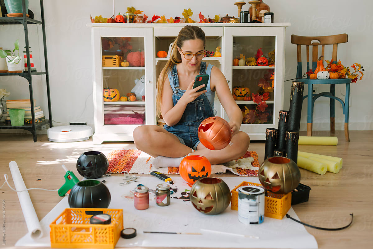 A woman creates content for a blog of a Halloween DIY