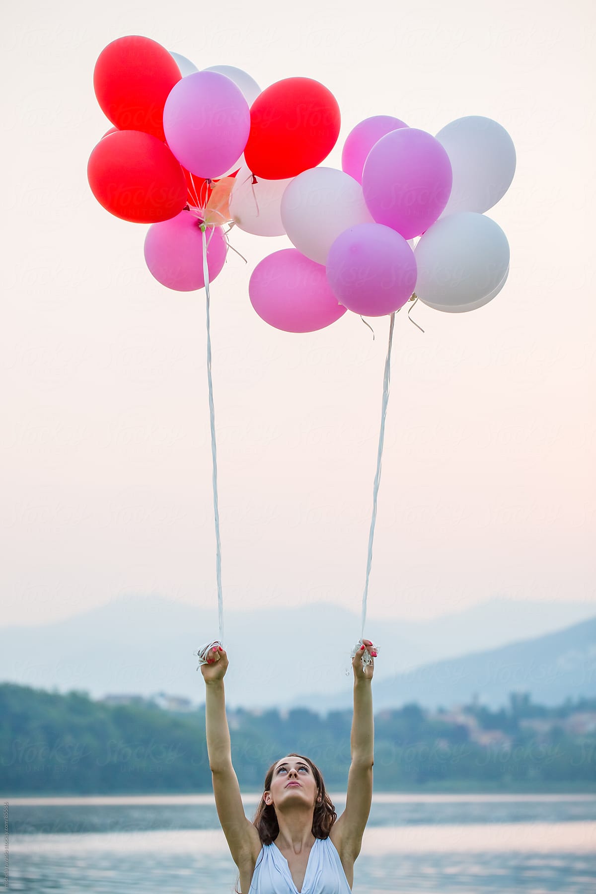 Young Woman With Balloons Del Colaborador De Stocksy Michela Ravasio Stocksy 