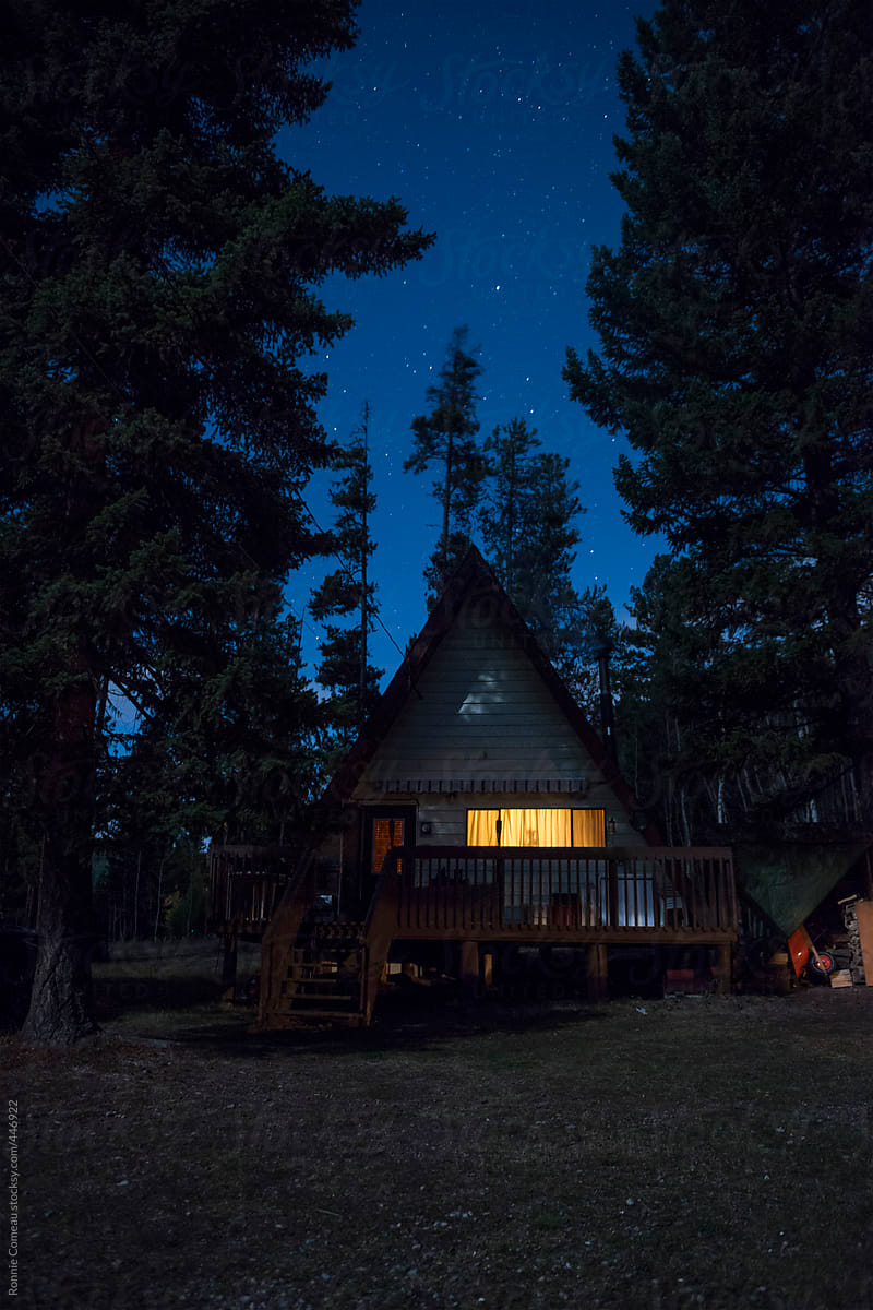 Quaint A-Frame Cabin In The Woods At Night