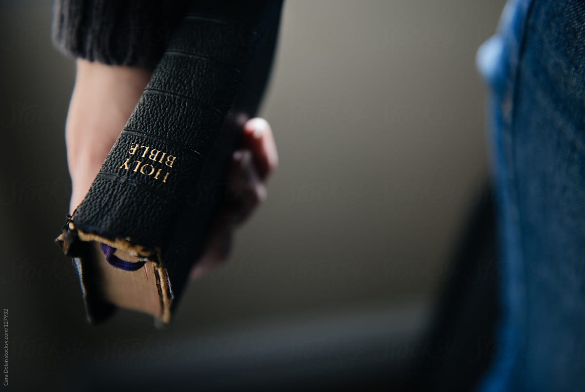 Woman holding bible