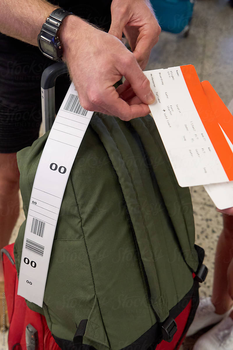Man holding boarding passes for flight