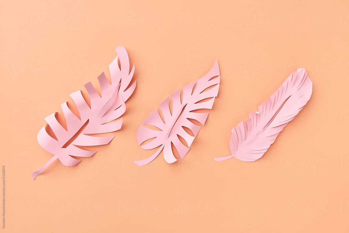 Paper tropical pattern with craft pink leaf on beige background