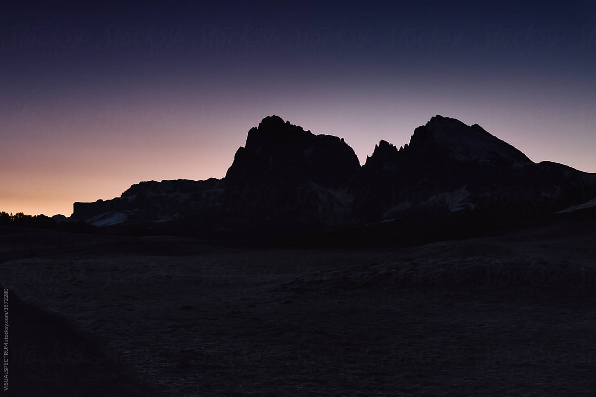 First Light And Dawn Sky With Mountain Range Silhouette