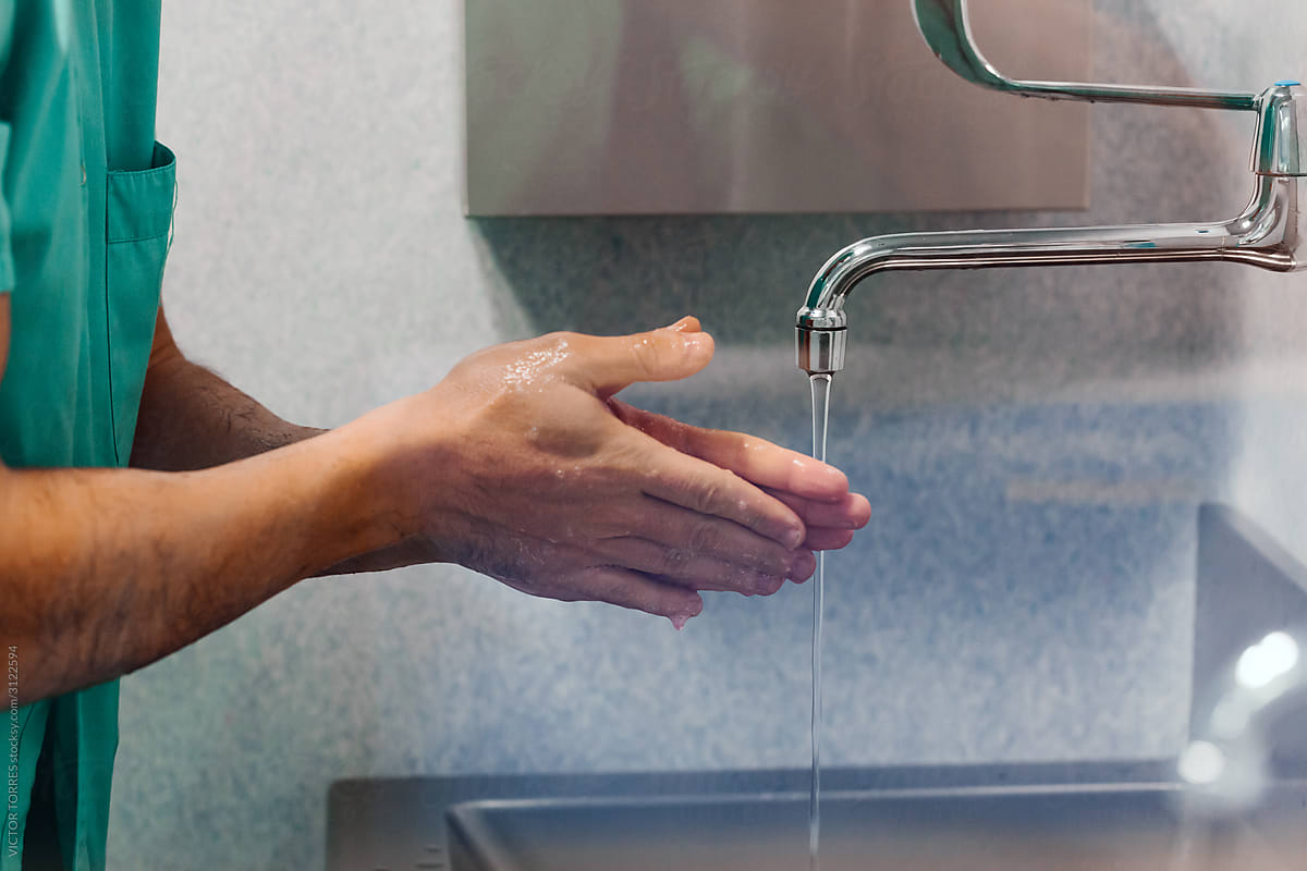 Doctor washing hands before a surgical intervention