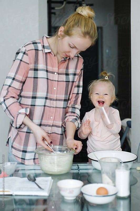 Happy mother and child while cooking