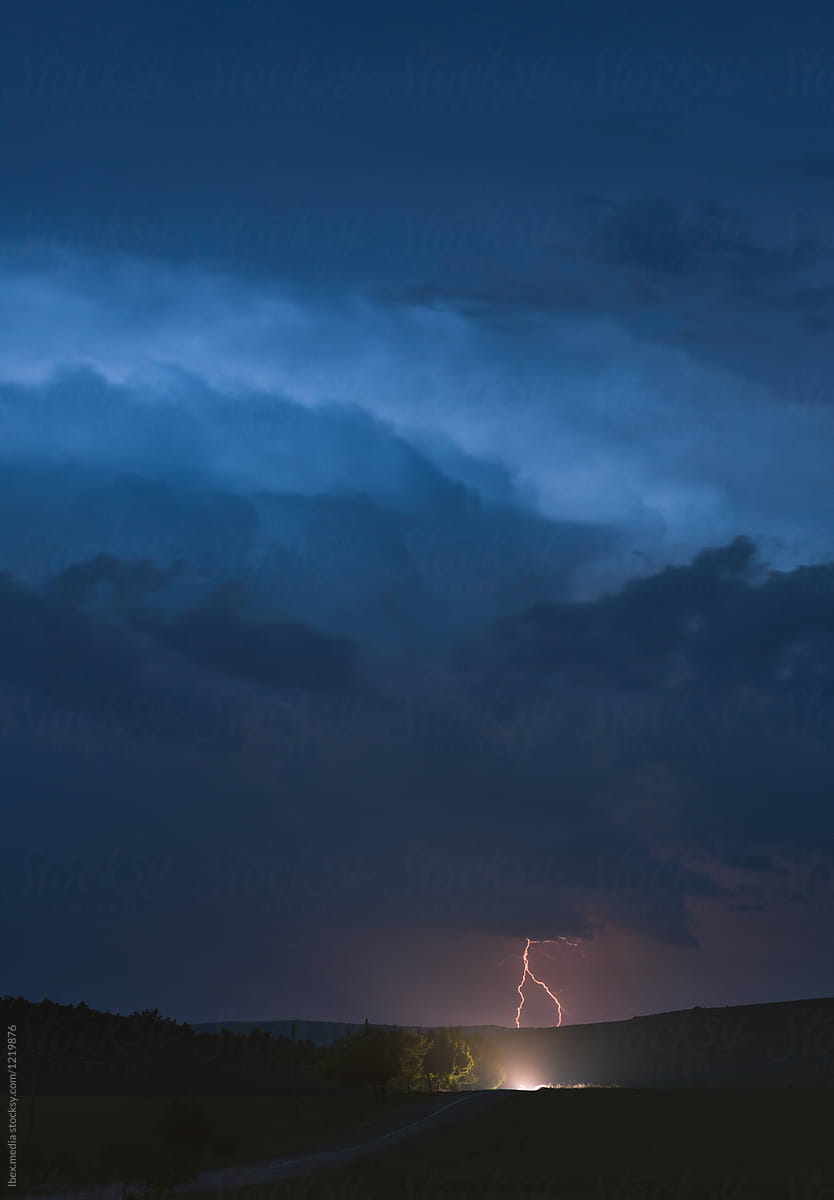 Nature landscape on a summer night with thunderstorm approaching