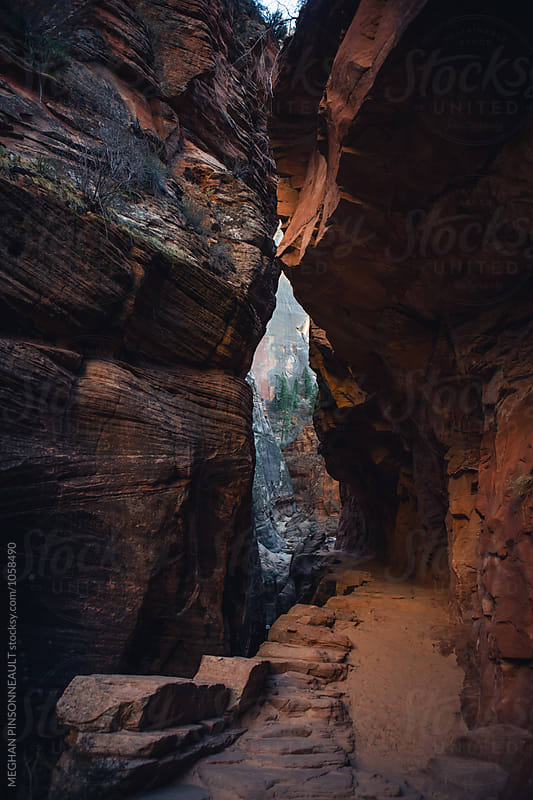 Passageway Through Vibrant Red Rocks at Dusk